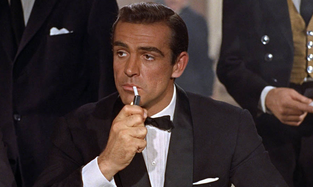 Sean Connery lights a cigarette in Dr No
