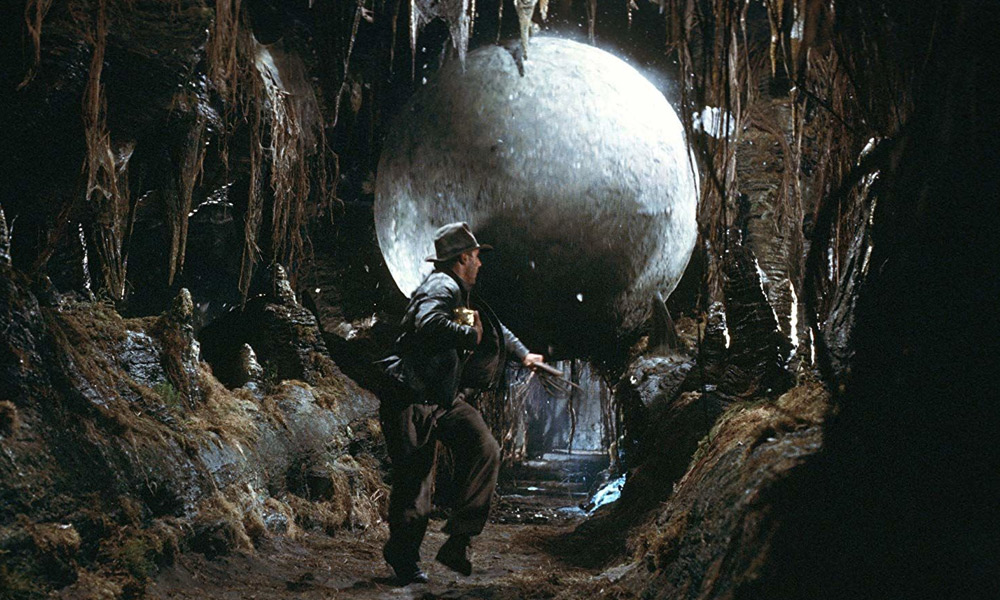 Indiana Jones runs from the boulder