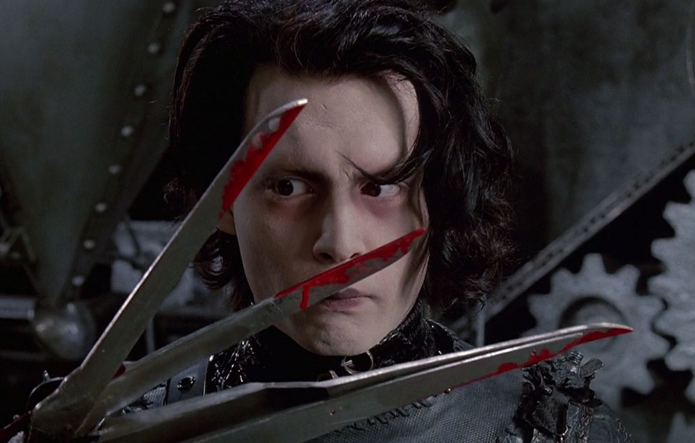Edward Scissorhands looks at his bloody blades